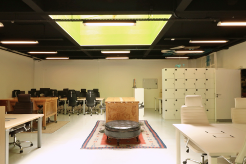 a room filled with furniture and a box on a table