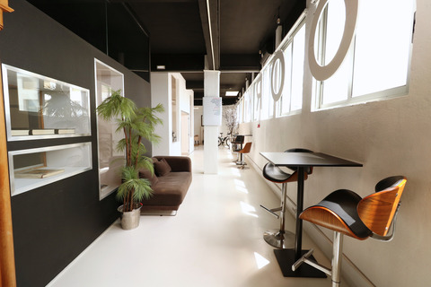 a room filled with furniture and a large window