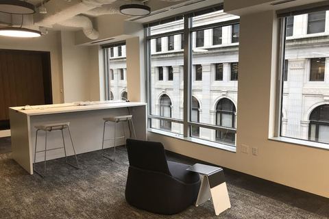 a room filled with furniture and a large window