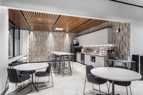 a room with white tables and chairs