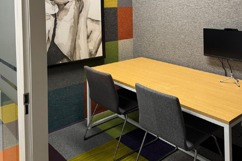 a desk with a chair in a room