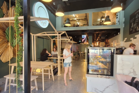 a person standing in front of a store