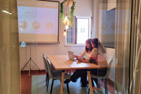 a person sitting at a table in a room