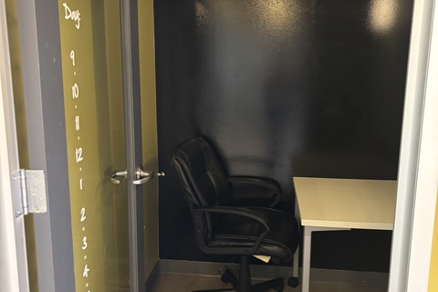 a chair and desk in a room