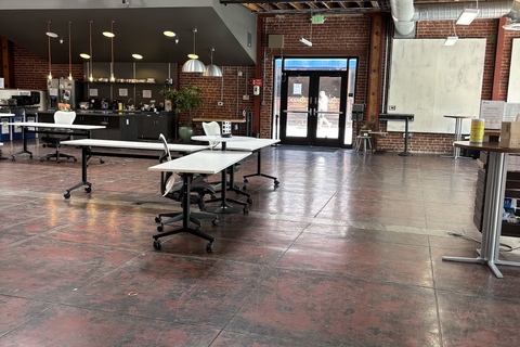 a large room with tables and chairs
