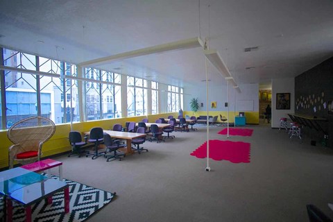 Bright natural sunlight shadowing the coworking area