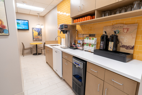 a kitchen with a sink and a refrigerator