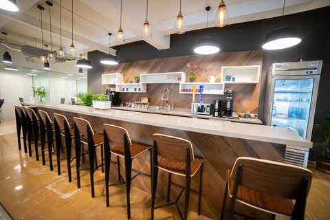 a kitchen with a table in a restaurant