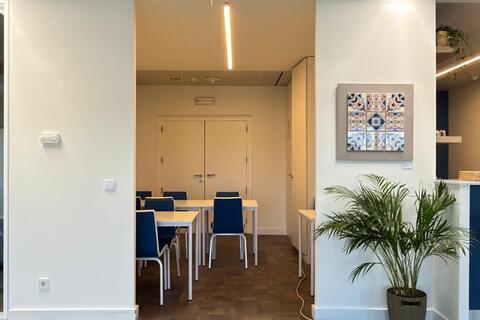 a room with a table and chairs