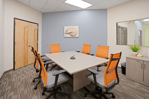 a conference room with chairs and a table