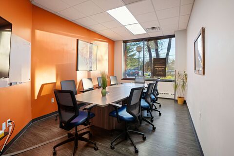 a room with a table and chairs