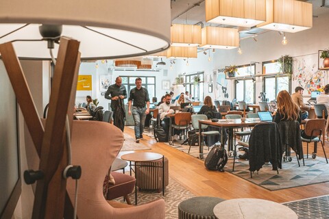 a group of people sitting at a table in a room