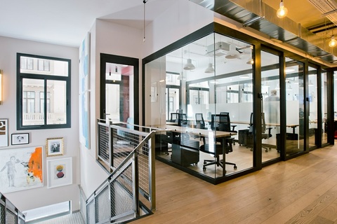 a room filled with furniture and a large window