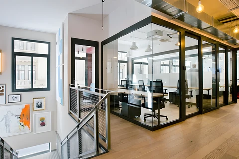 a room filled with furniture and a large window