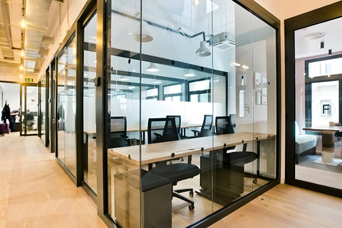 a room filled with furniture and a large window