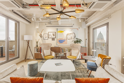 a living room filled with furniture and a fireplace