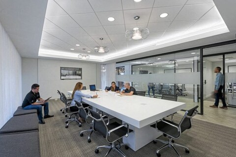 people sitting at a table in a meeting room