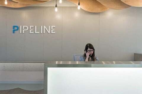a woman sitting at a reception desk