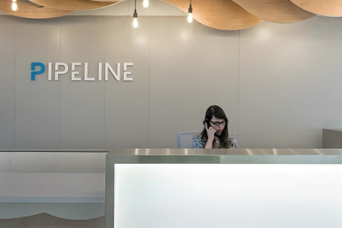a woman sitting at a reception desk