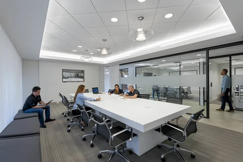 people sitting at a table in a meeting room