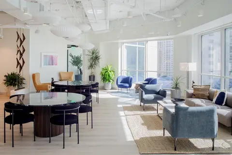 a room with chairs and tables
