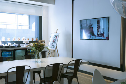 a living room filled with furniture and a large window