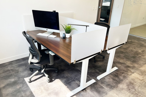 a desk with a laptop in a room