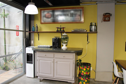 a kitchen with a stove top oven sitting inside of a room