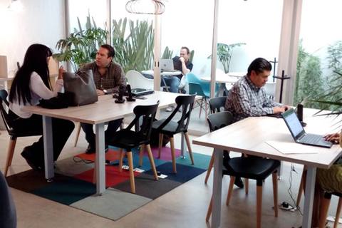 a group of people sitting at a table in a room