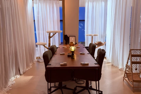 a living room filled with furniture and a large window