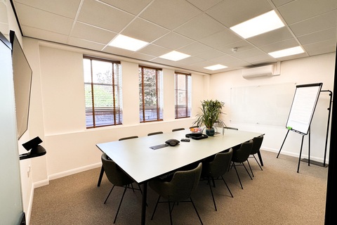a room filled with furniture and a large window