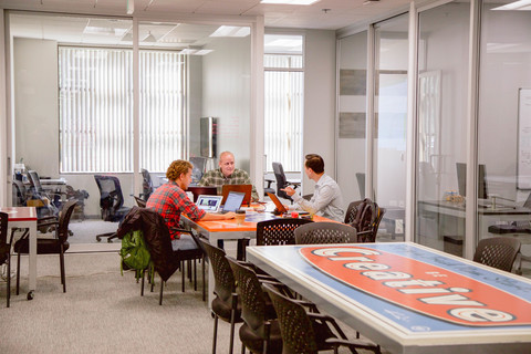 a group of people sitting at a table in a room