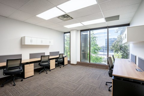 a room filled with furniture and a large window