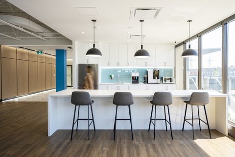 an office with a desk and chair in a room