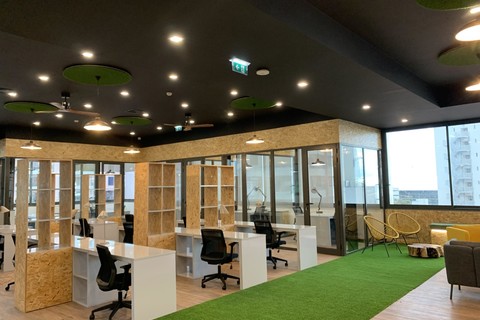 a room filled with furniture and a large window