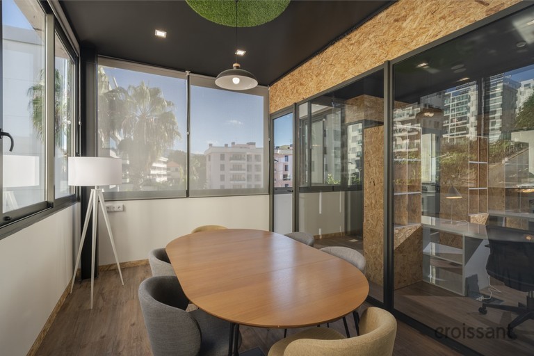 a room filled with furniture and a large window
