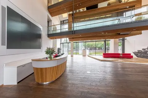 a kitchen area with a building in the background