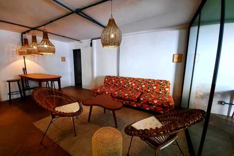 a living room with a couch and a chair