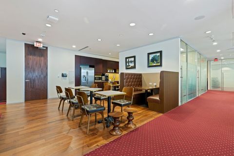 a room filled with furniture on top of a wooden floor