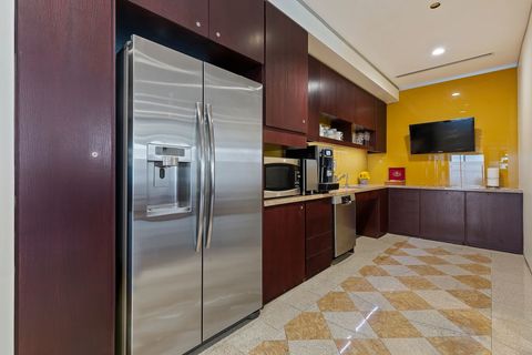 a stainless steel refrigerator in a kitchen