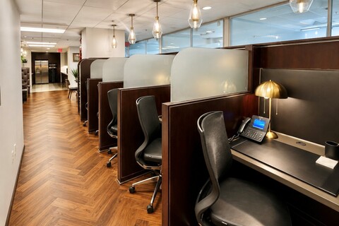 a office cubicle with desks and chairs