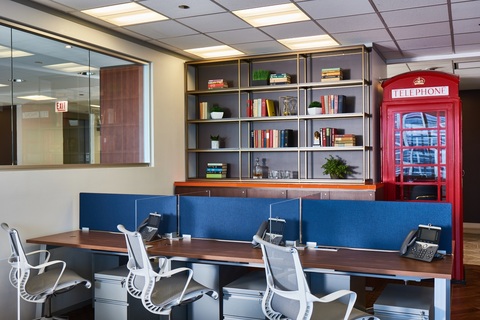 an office with a desk and chair in a room