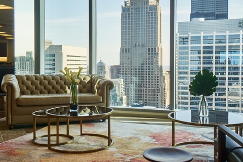 a living room filled with furniture and a large window