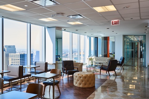 a room filled with furniture and a large window