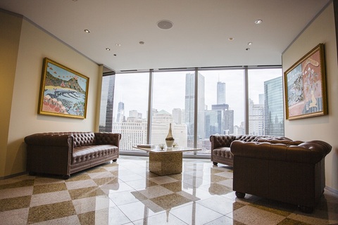a living room filled with furniture and a large window