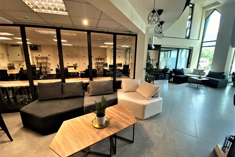 a room filled with furniture and a large window