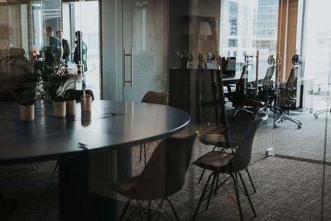 a dining room table in front of a window