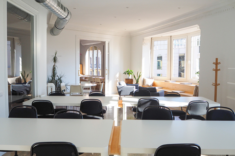 a room filled with furniture and a large window