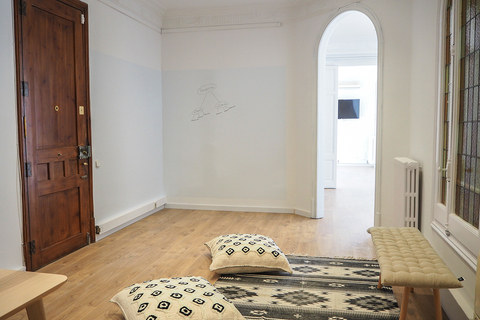a bedroom with a bed in a room