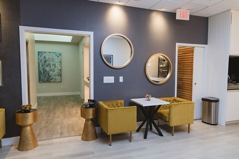a room filled with furniture and a fireplace